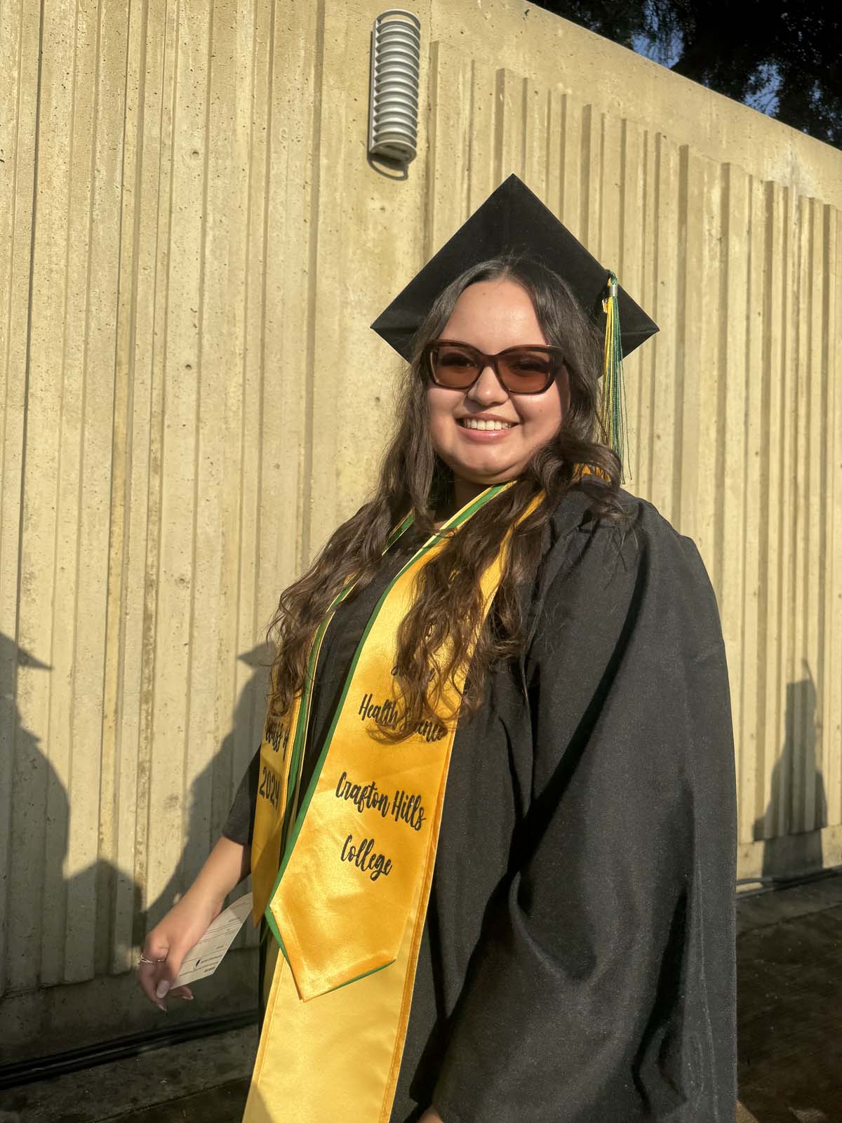 Graduates walk to stage at CHC's Commencement 2024.