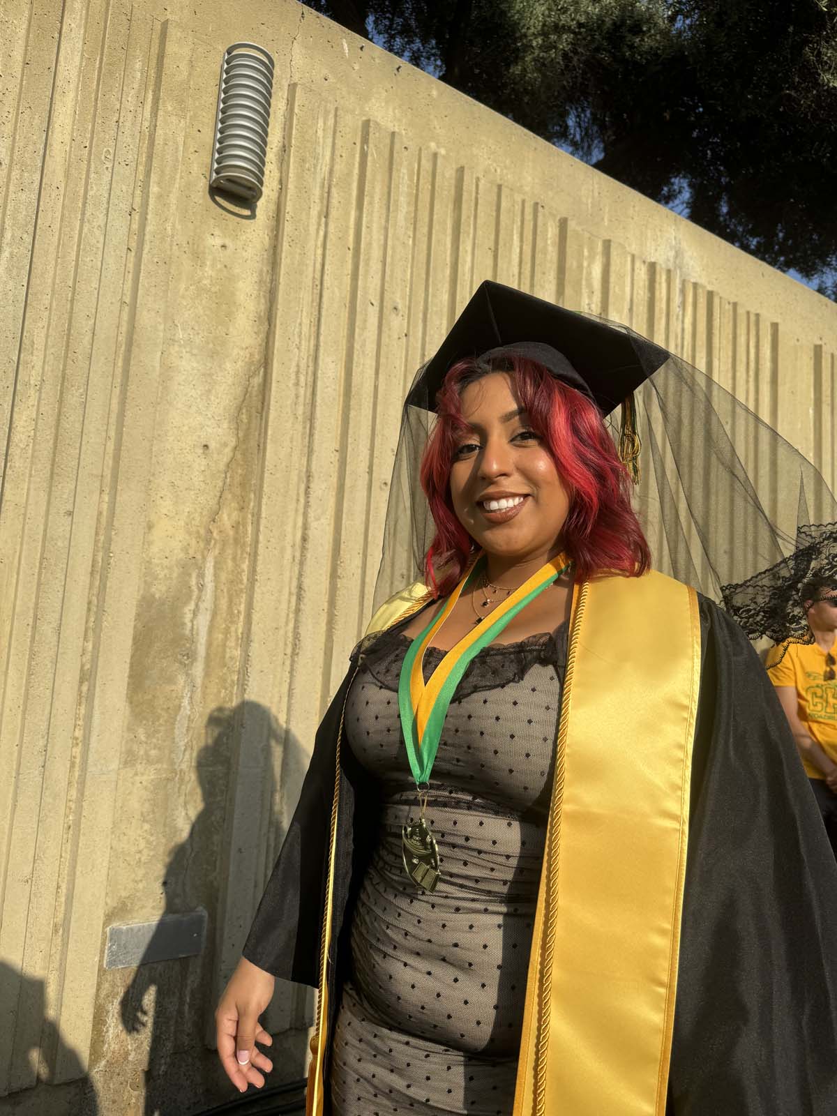 Graduates walk to stage at CHC's Commencement 2024.