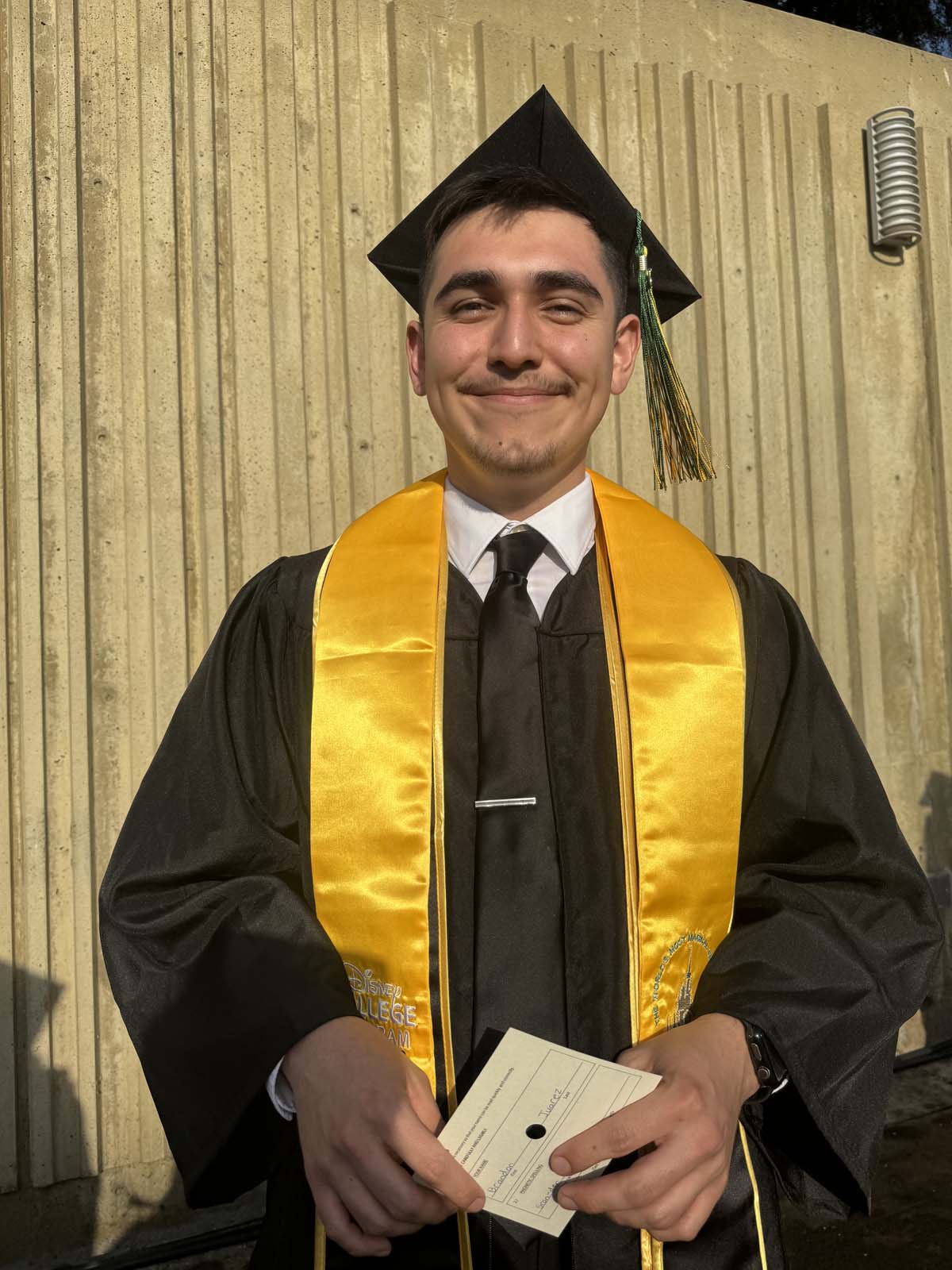 Graduates walk to stage at CHC's Commencement 2024.