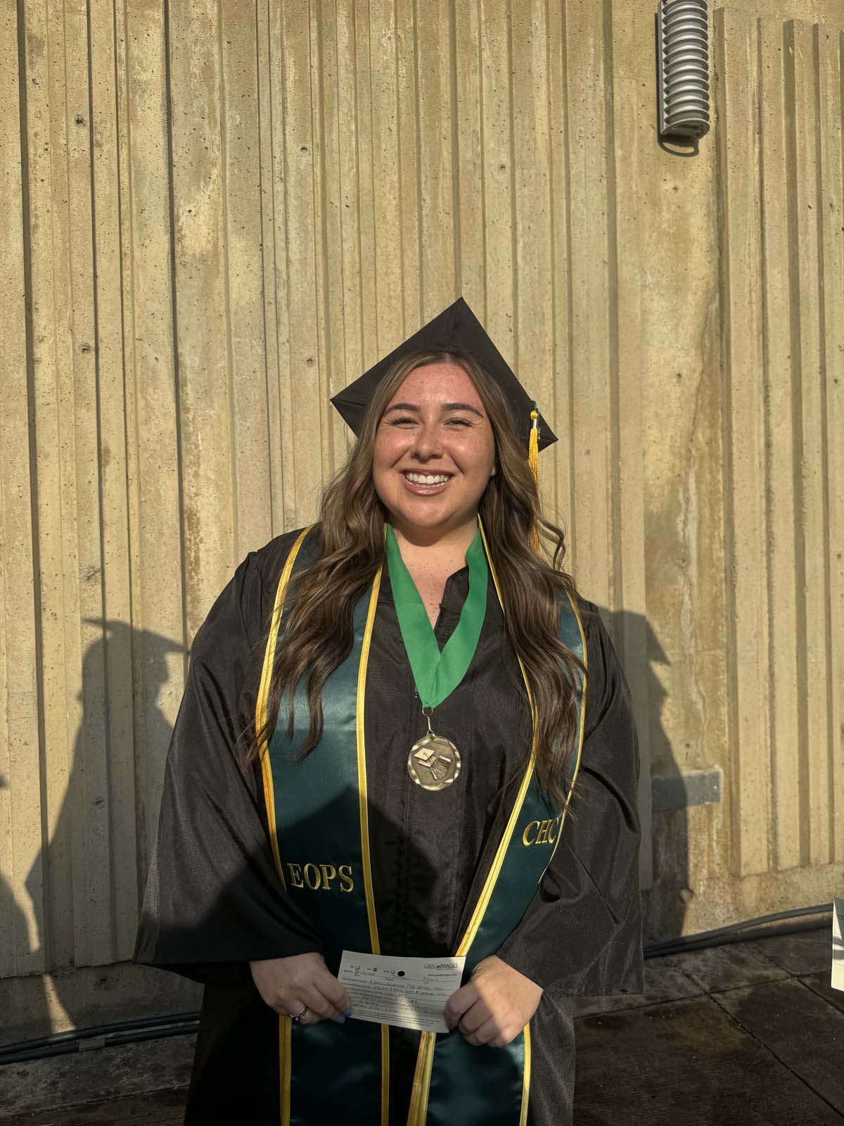 Graduates walk to stage at CHC's Commencement 2024.