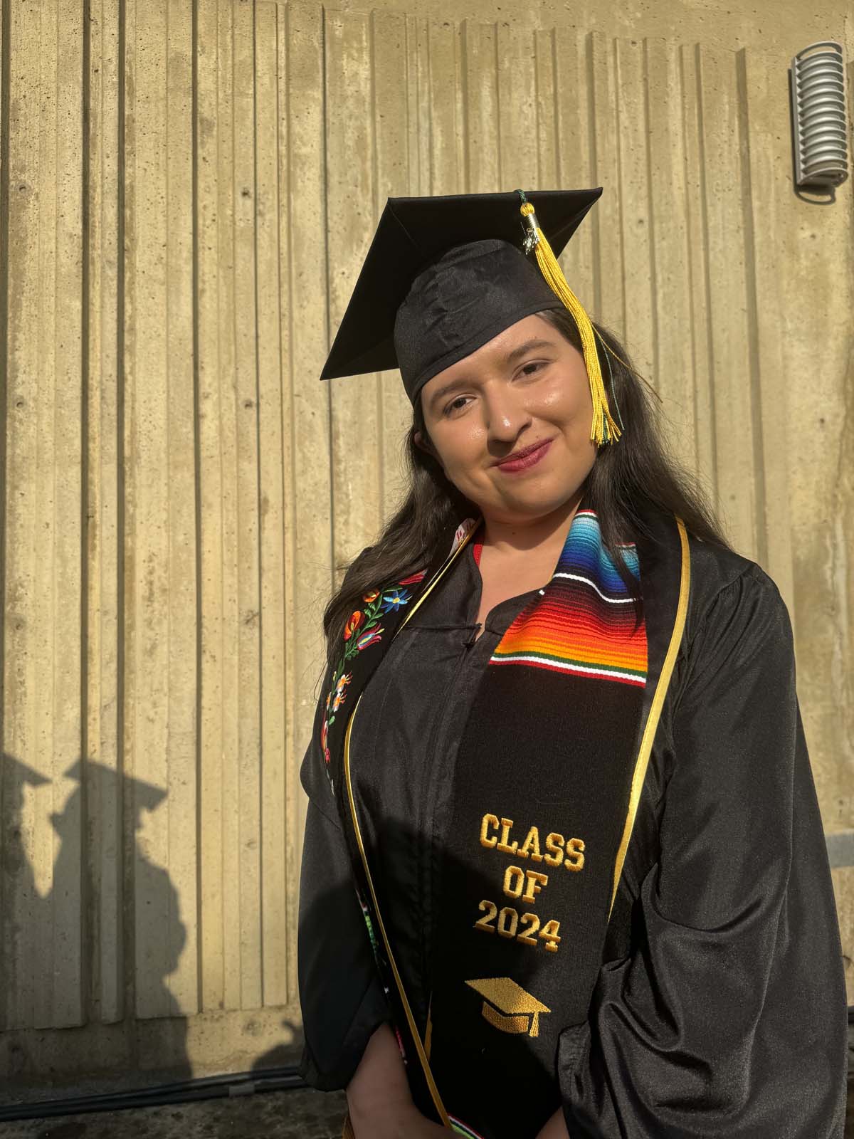 Graduates walk to stage at CHC's Commencement 2024.
