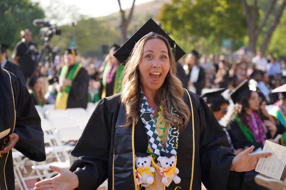 Graduates walk to stage at CHC's Commencement 2024.