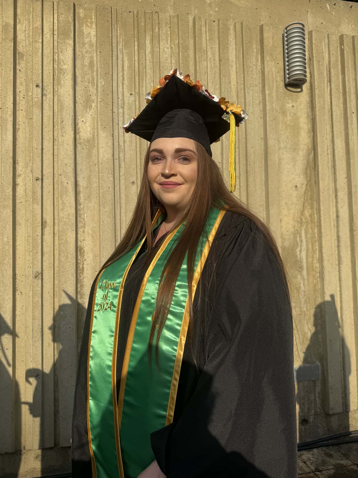 Graduates walk to stage at CHC's Commencement 2024.