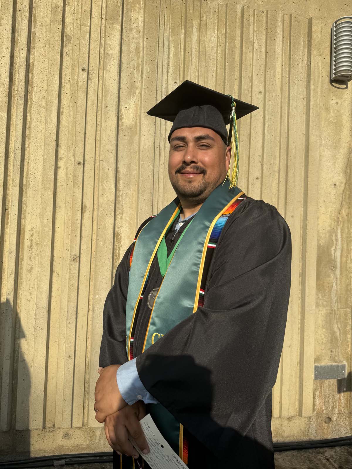 Graduates walk to stage at CHC's Commencement 2024.