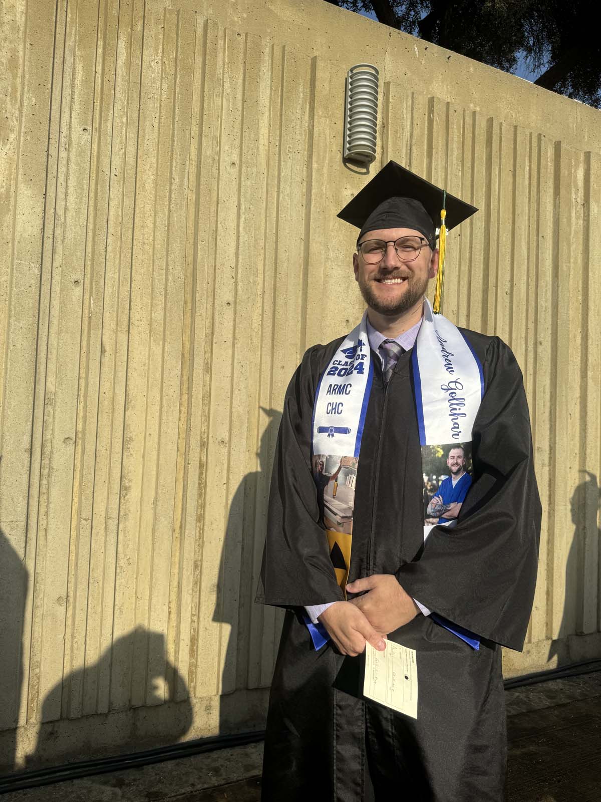 Graduates walk to stage at CHC's Commencement 2024.