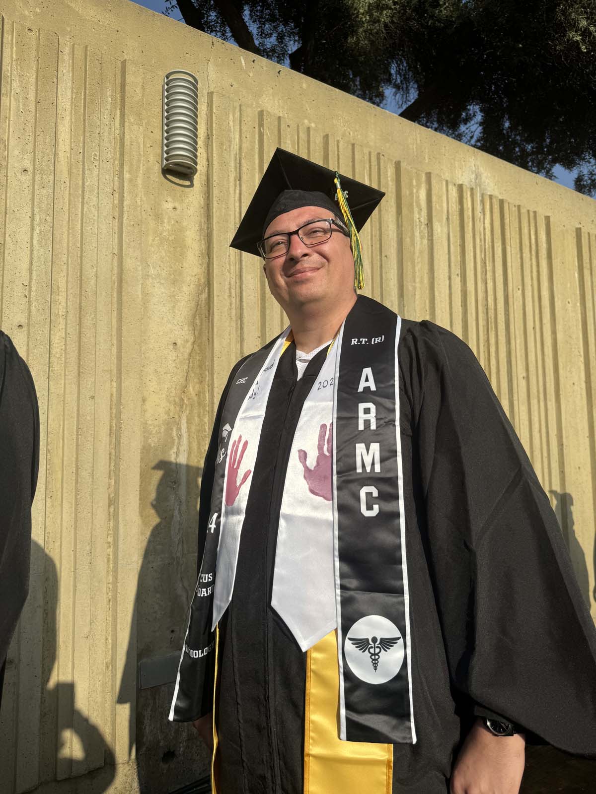 Graduates walk to stage at CHC's Commencement 2024.