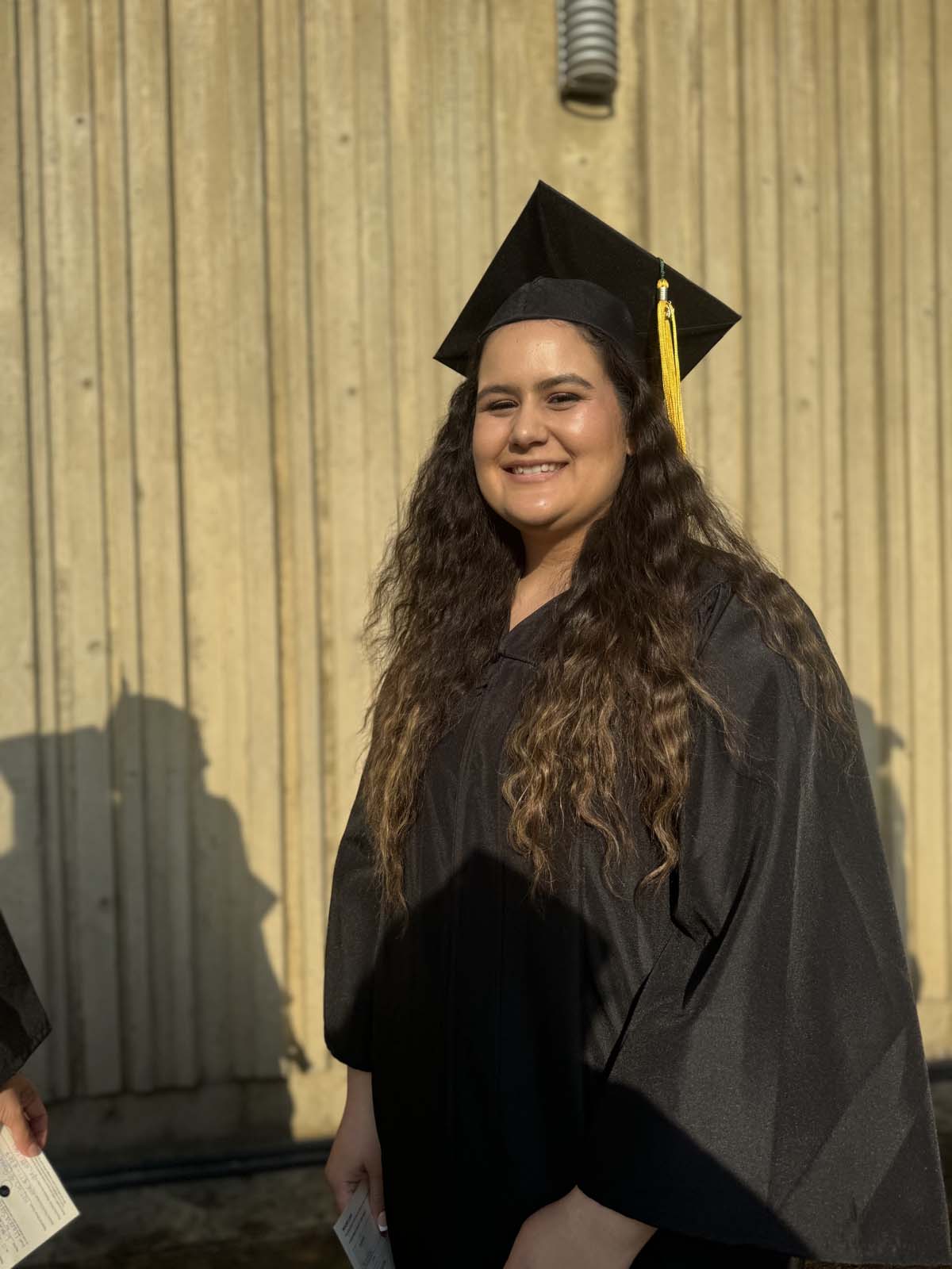 Graduates walk to stage at CHC's Commencement 2024.
