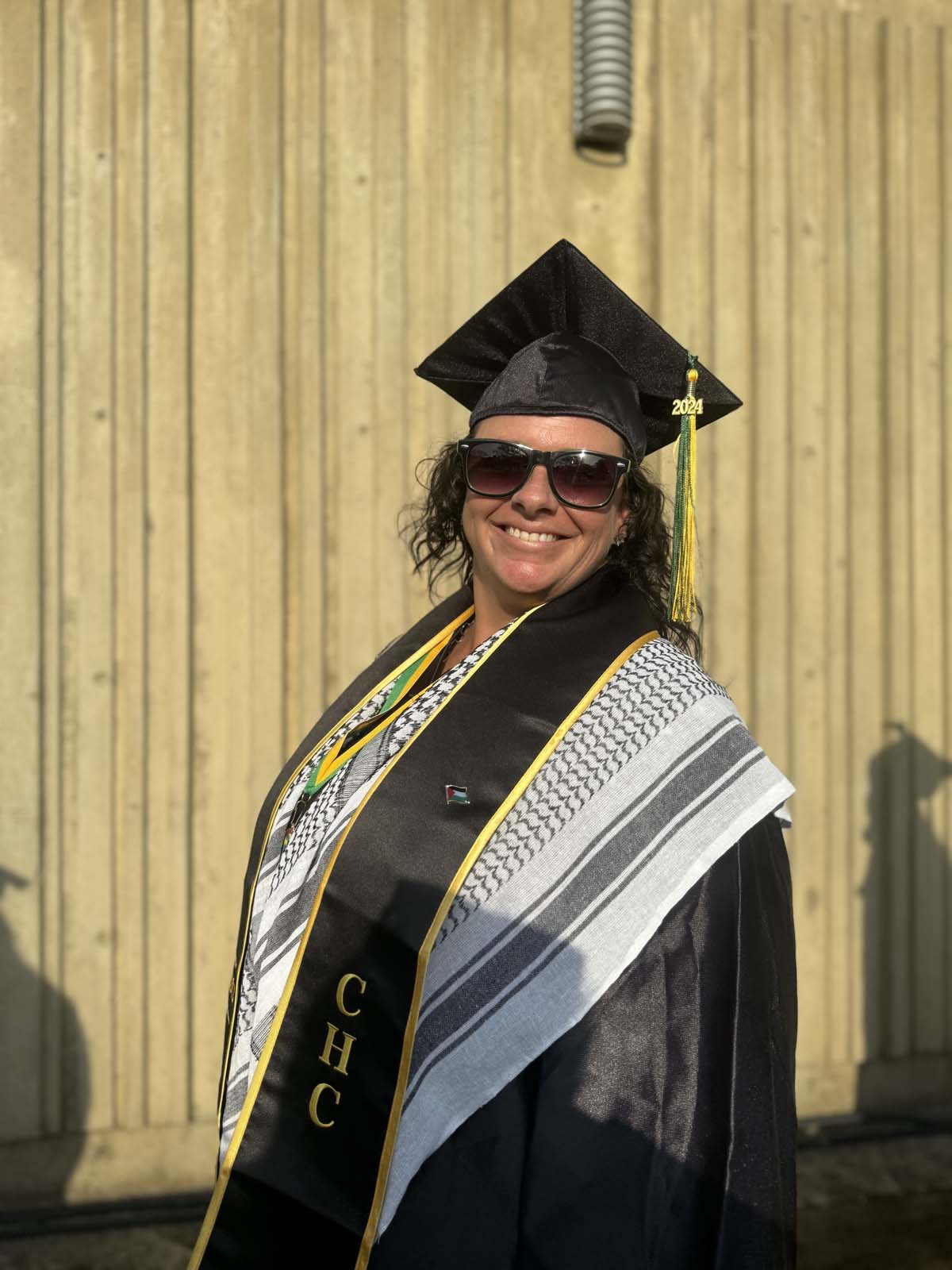 Graduates walk to stage at CHC's Commencement 2024.
