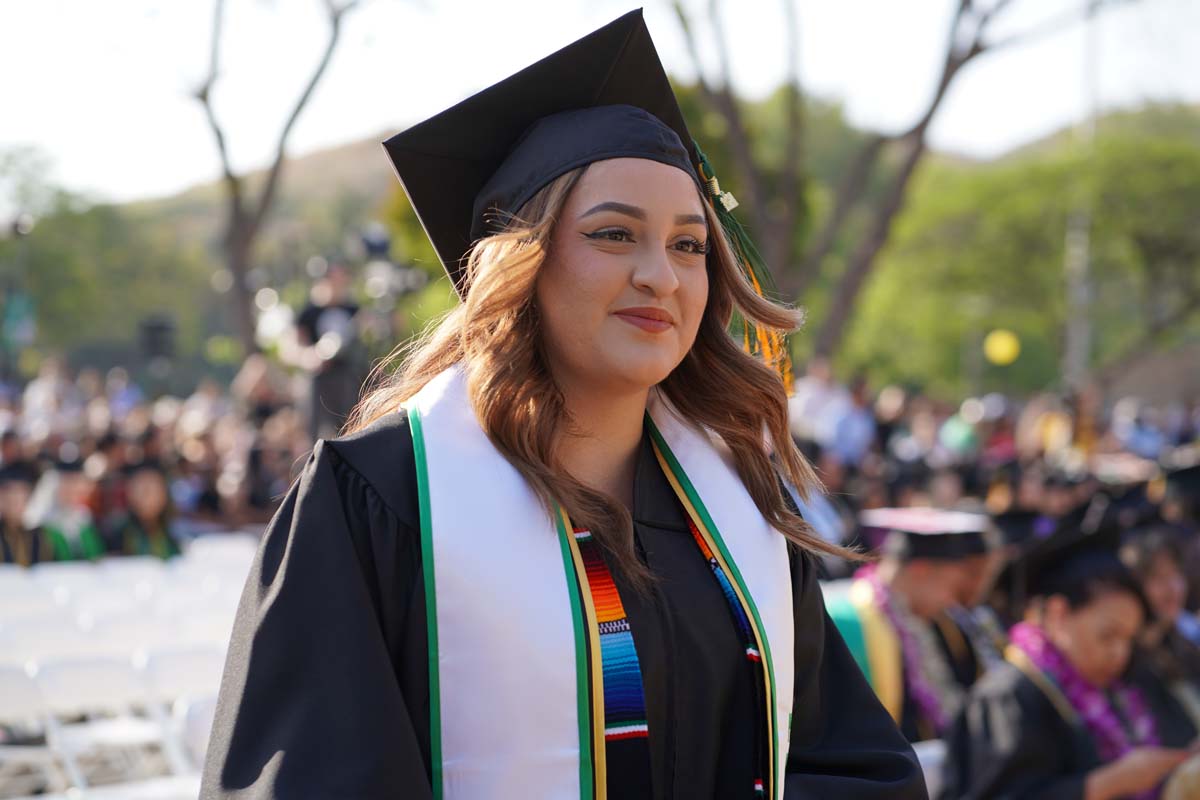 Graduates walk to stage at CHC's Commencement 2024.