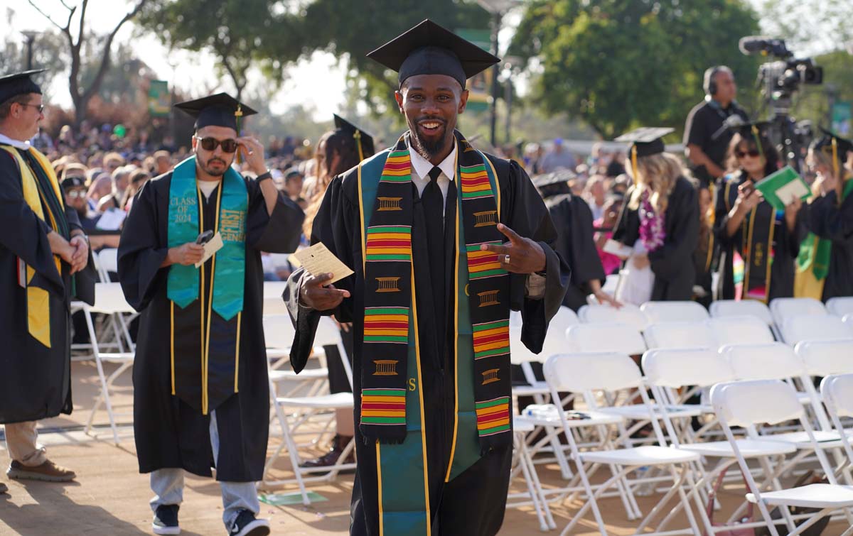 Graduates walk to stage at CHC's Commencement 2024.