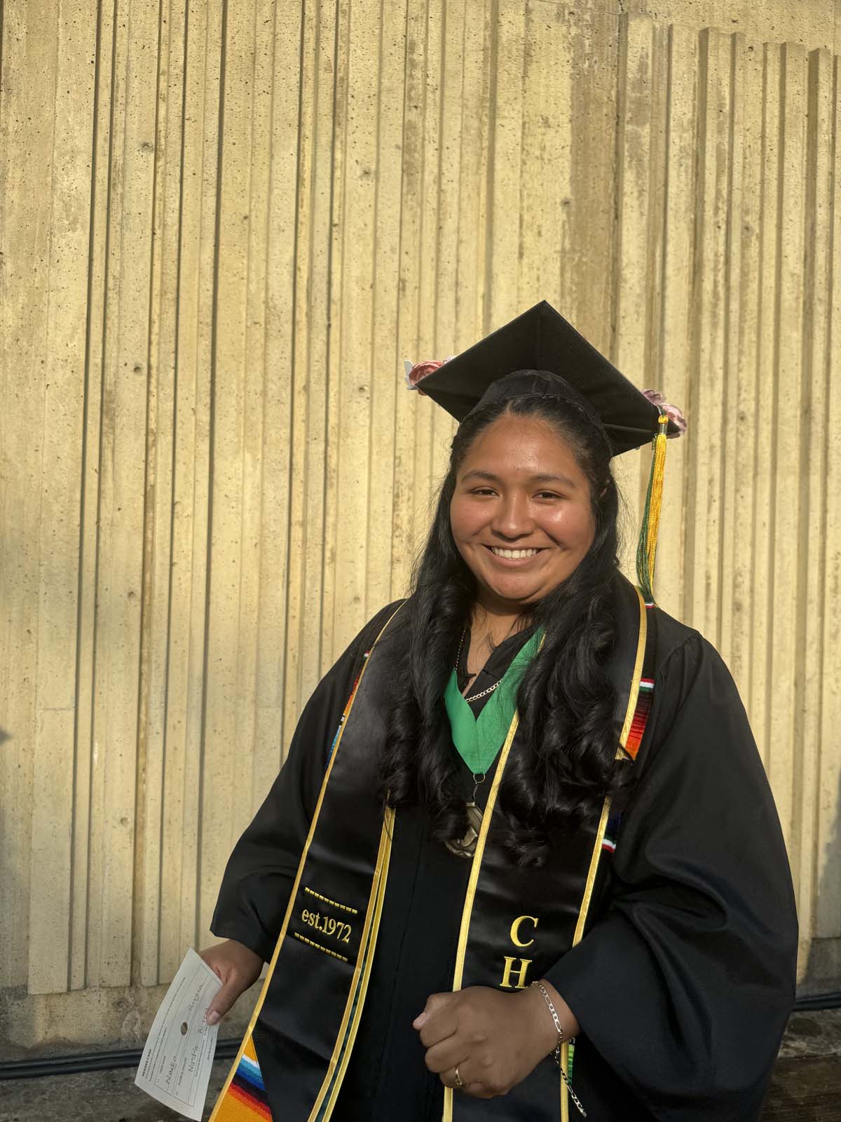 Graduates walk to stage at CHC's Commencement 2024.