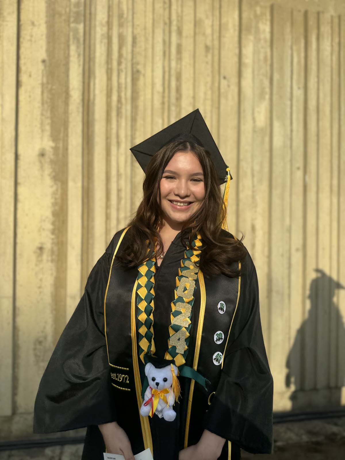 Graduates walk to stage at CHC's Commencement 2024.