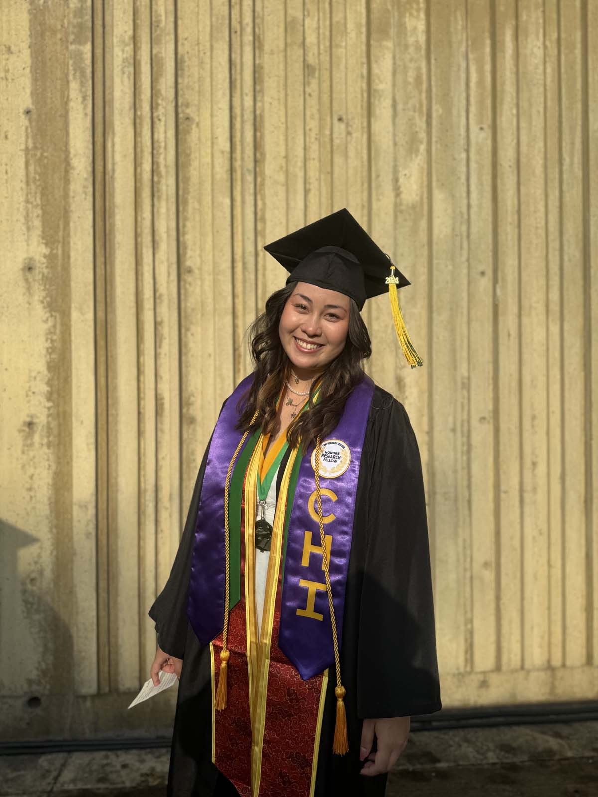Graduates walk to stage at CHC's Commencement 2024.