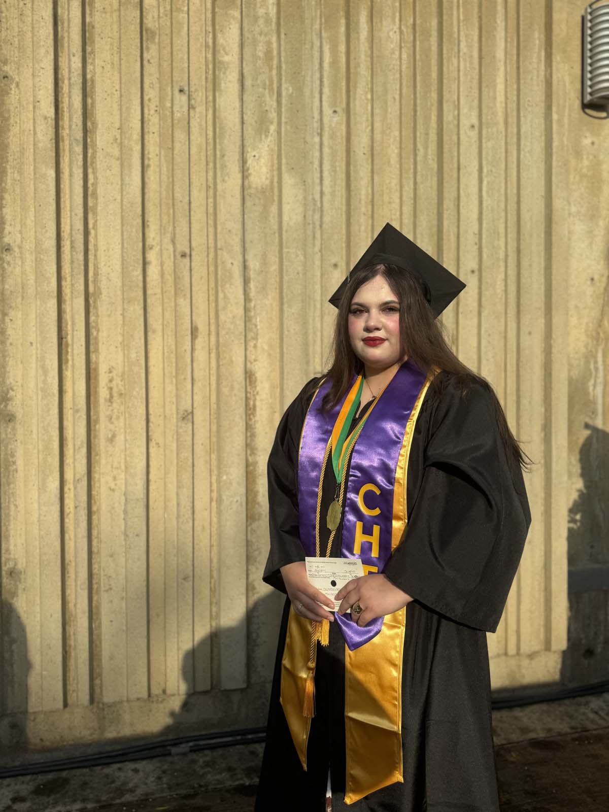 Graduates walk to stage at CHC's Commencement 2024.