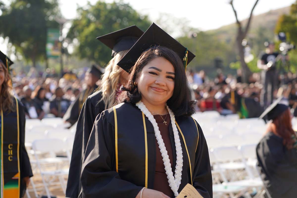 Graduates walk to stage at CHC's Commencement 2024.