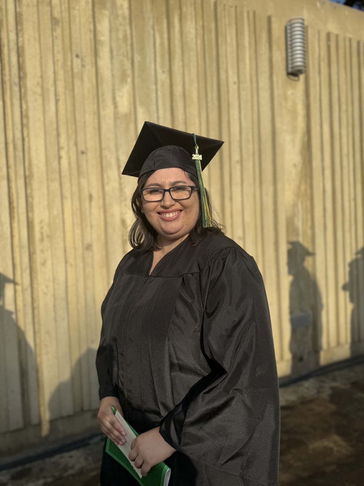 Graduates walk to stage at CHC's Commencement 2024.