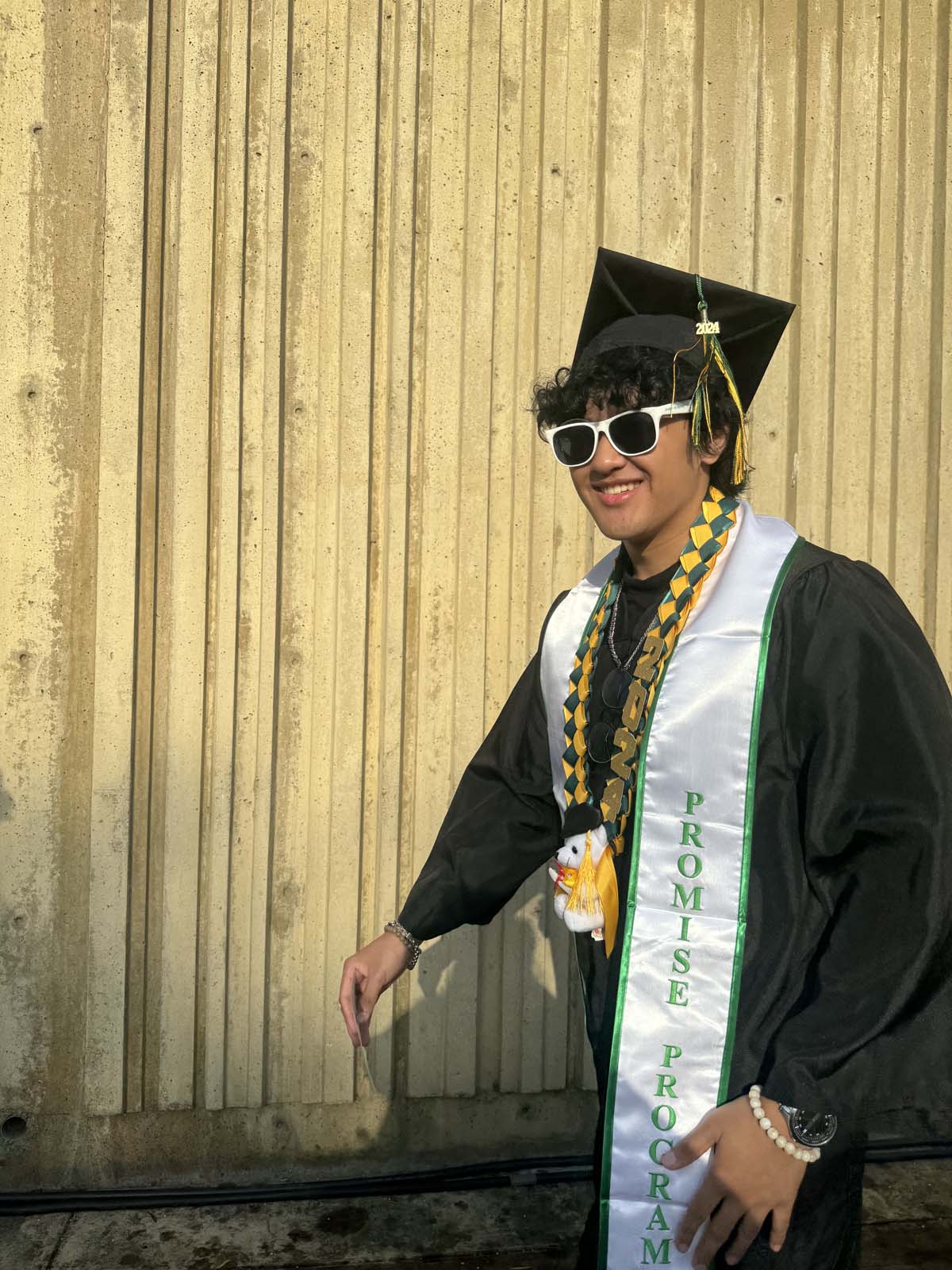 Graduates walk to stage at CHC's Commencement 2024.