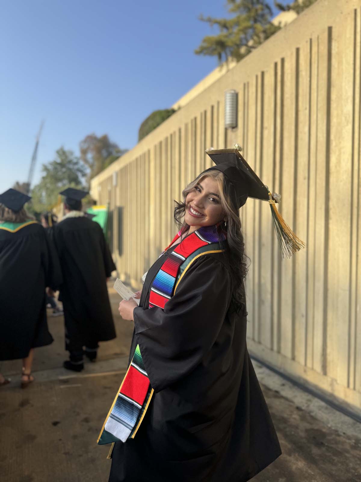 Graduates walk to stage at CHC's Commencement 2024.