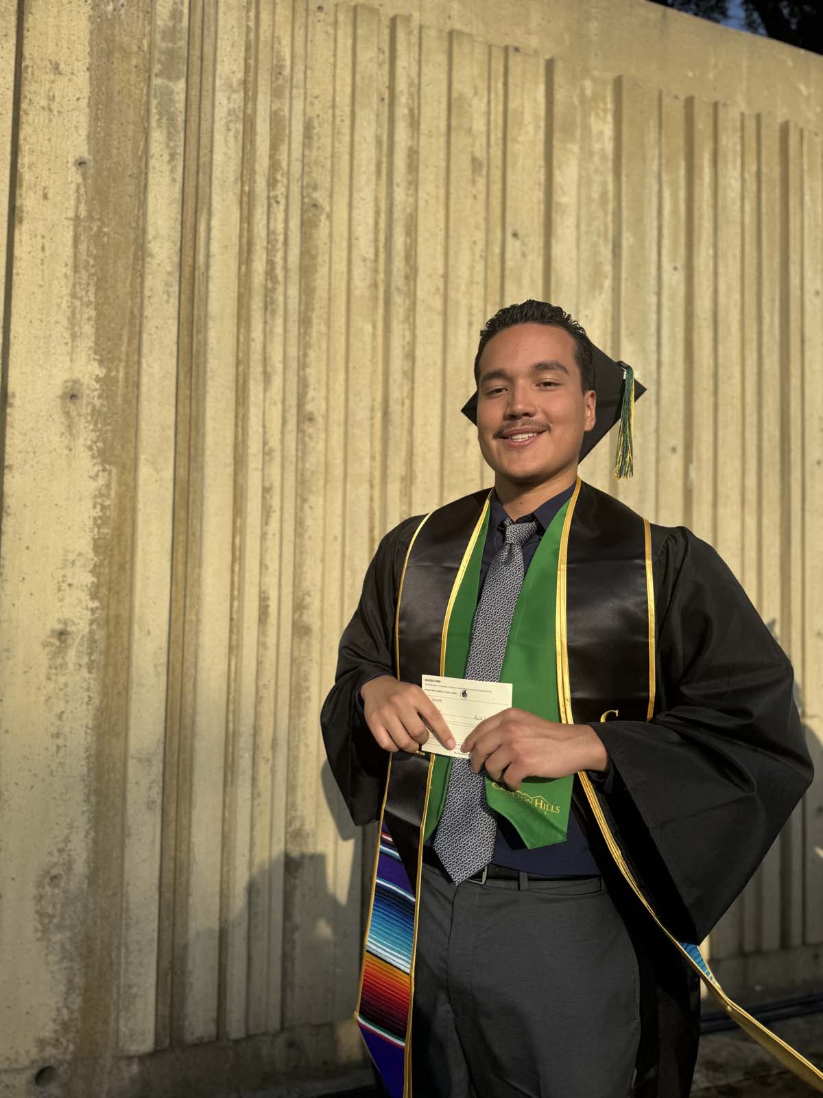 Graduates walk to stage at CHC's Commencement 2024.