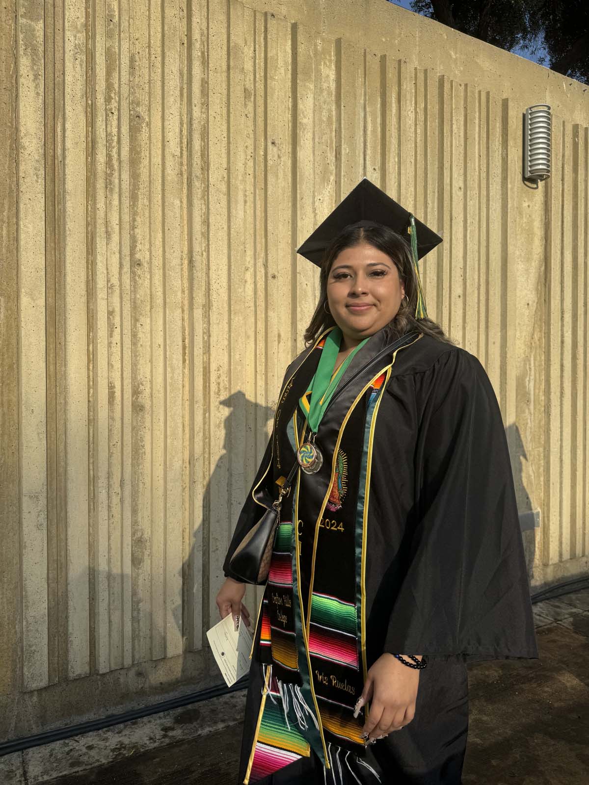Graduates walk to stage at CHC's Commencement 2024.