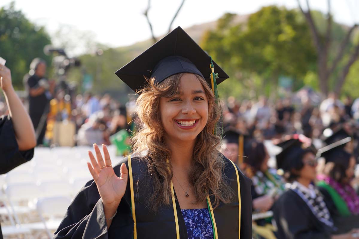 Graduates walk to stage at CHC's Commencement 2024.