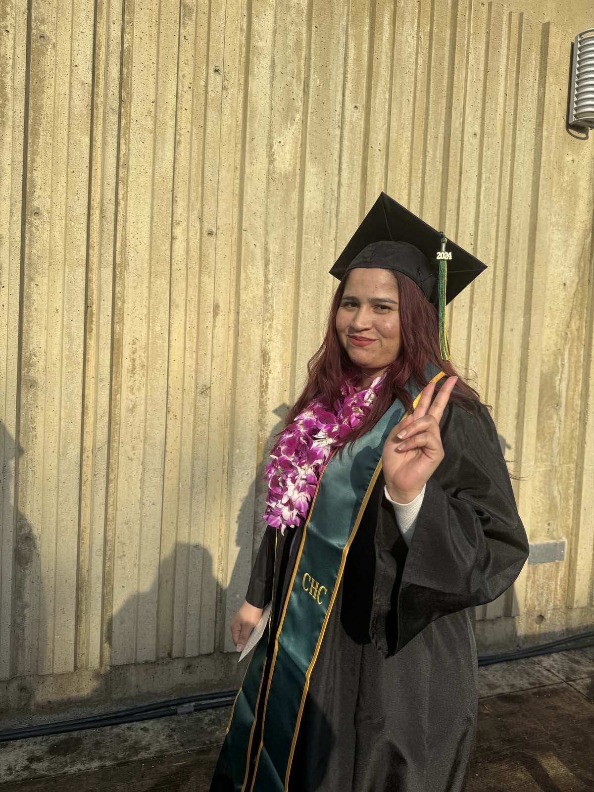 Graduates walk to stage at CHC's Commencement 2024.