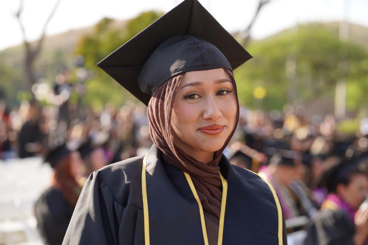Graduates walk to stage at CHC's Commencement 2024.