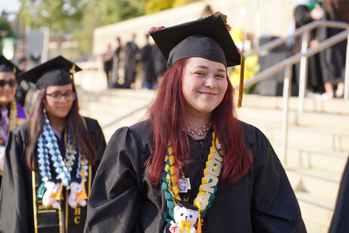 Graduates walk to stage at CHC's Commencement 2024.