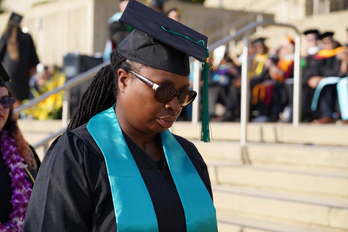 Graduates walk to stage at CHC's Commencement 2024.