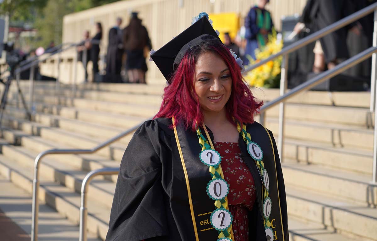 Graduates walk to stage at CHC's Commencement 2024.