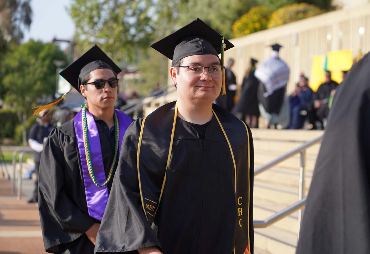 Graduates walk to stage at CHC's Commencement 2024.