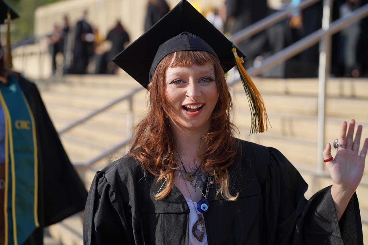 Graduates walk to stage at CHC's Commencement 2024.
