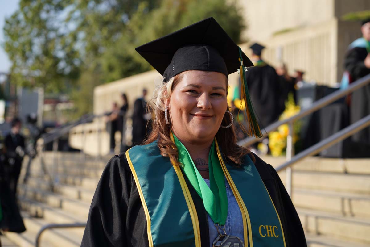 Graduates walk to stage at CHC's Commencement 2024.