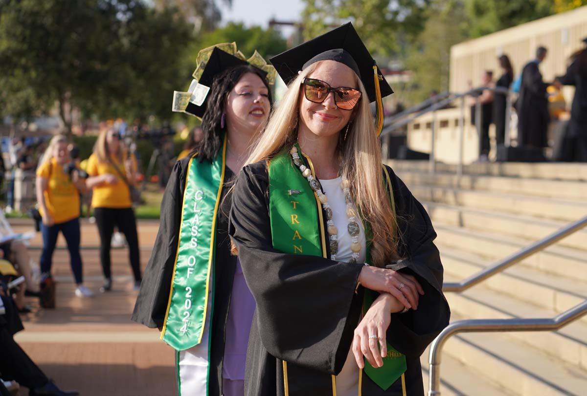 Graduates walk to stage at CHC's Commencement 2024.