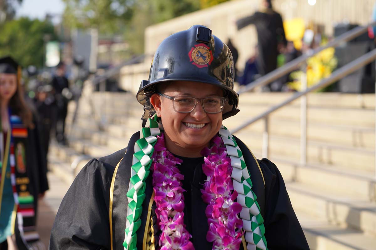 Graduates walk to stage at CHC's Commencement 2024.