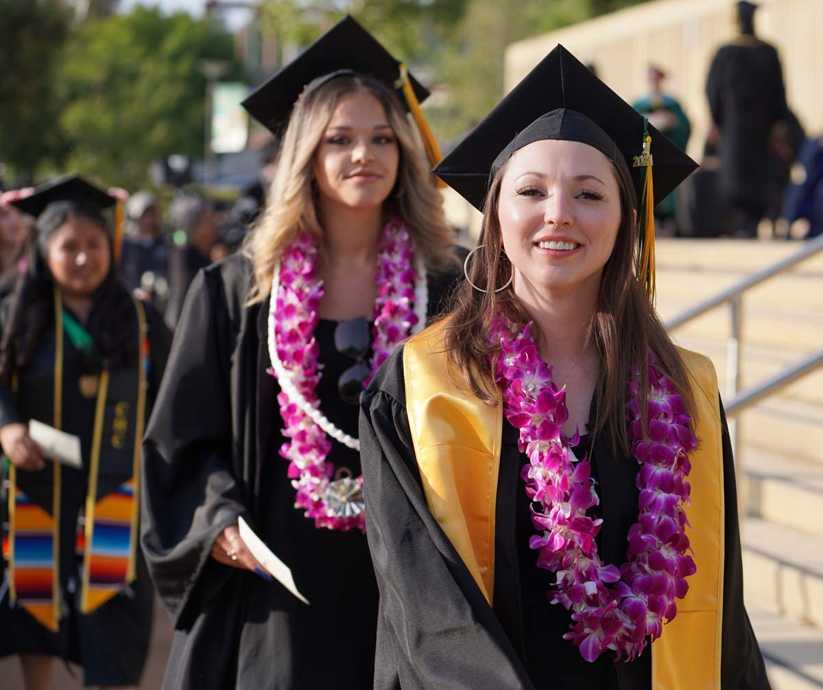 Graduates walk to stage at CHC's Commencement 2024.