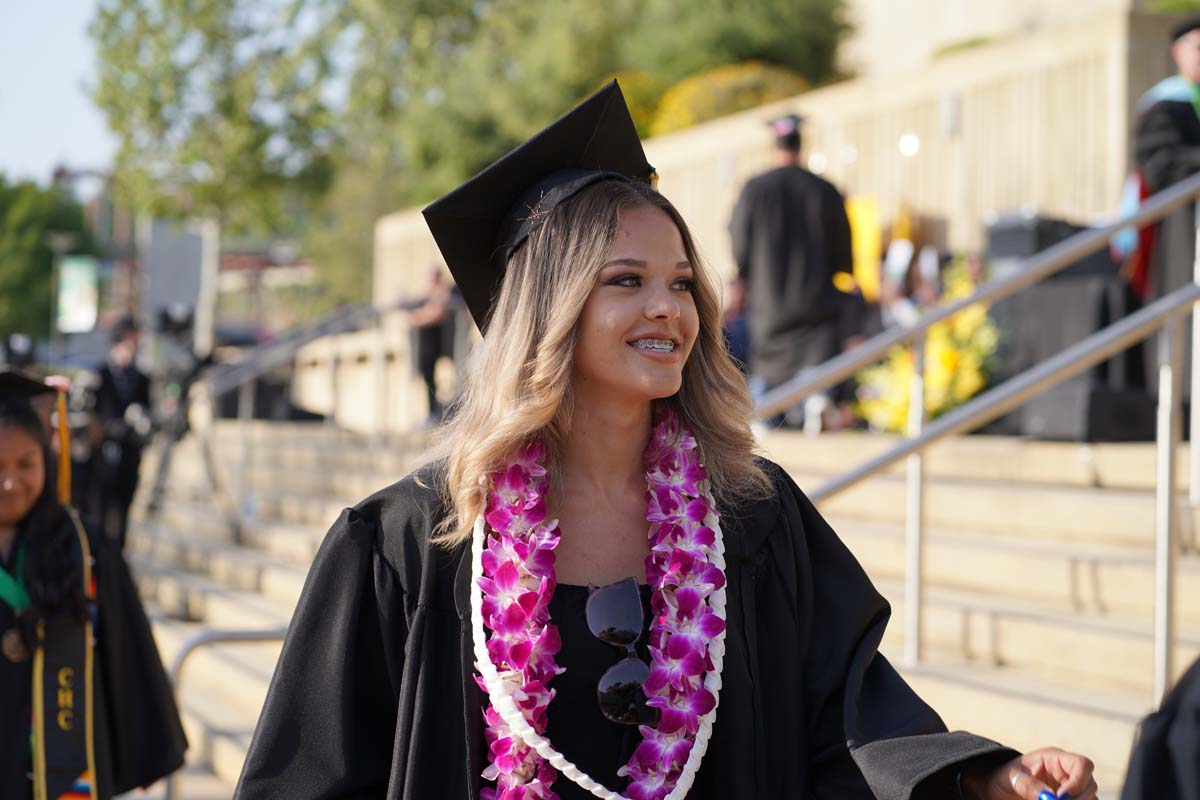 Graduates walk to stage at CHC's Commencement 2024.