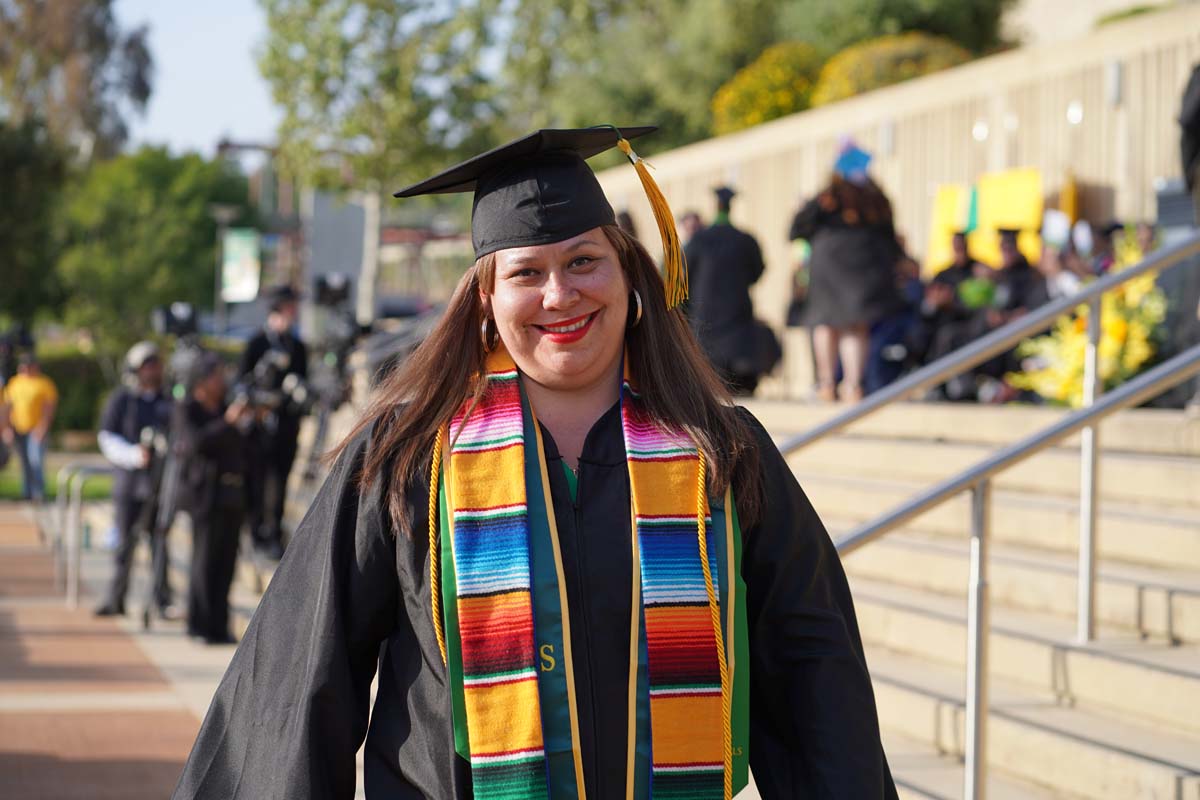 Graduates walk to stage at CHC's Commencement 2024.