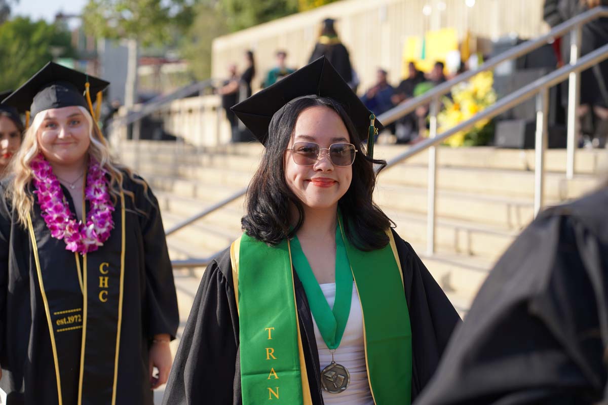 Graduates walk to stage at CHC's Commencement 2024.