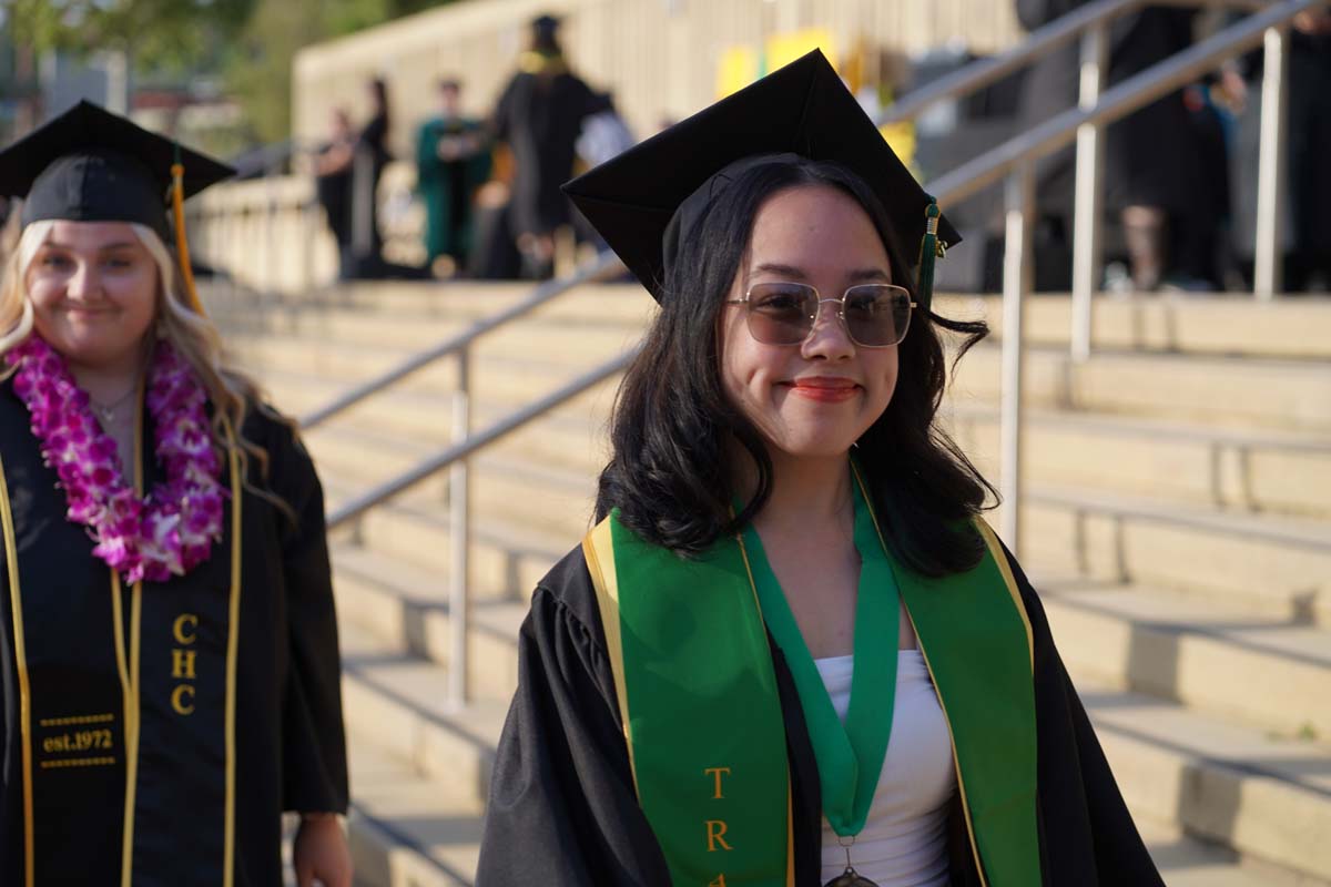 Graduates walk to stage at CHC's Commencement 2024.