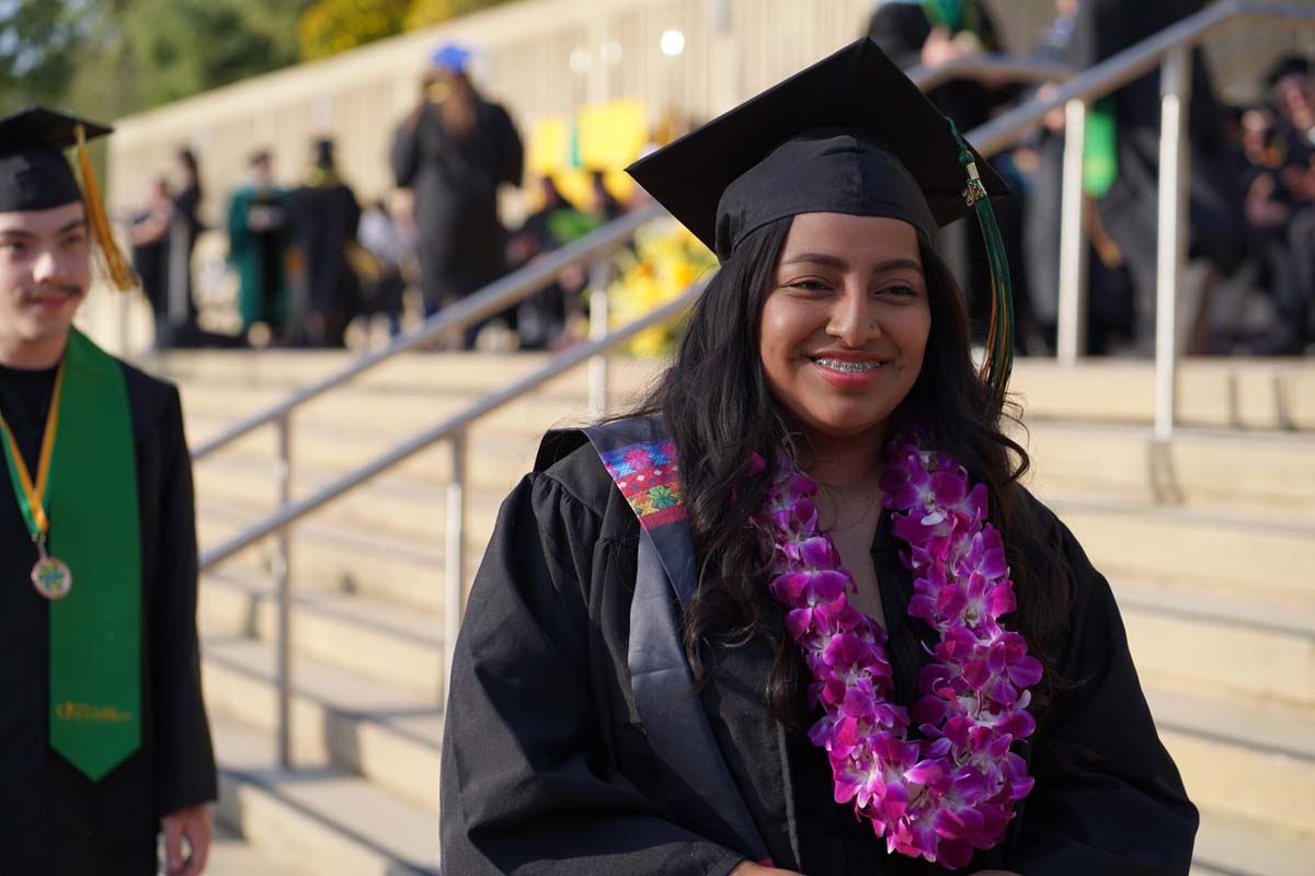 Graduates walk to stage at CHC's Commencement 2024.