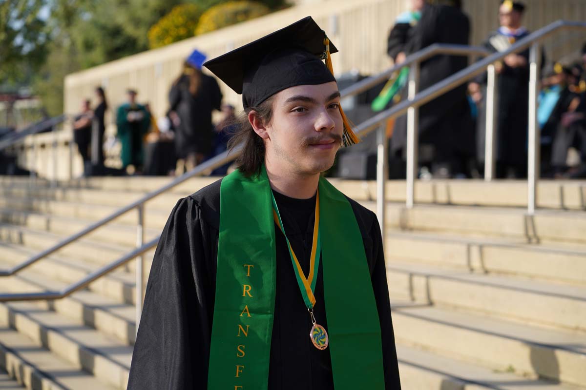 Graduates walk to stage at CHC's Commencement 2024.