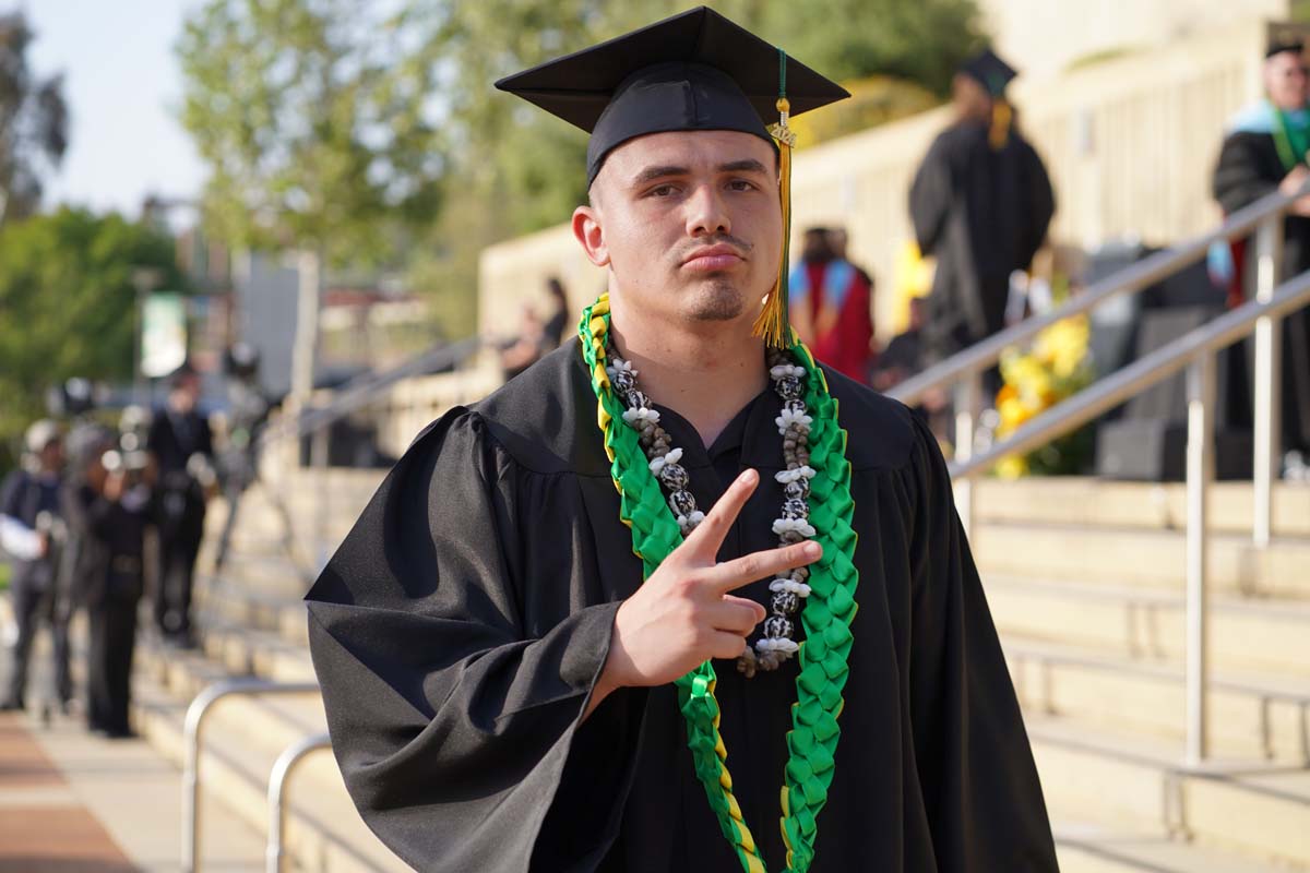 Graduates walk to stage at CHC's Commencement 2024.