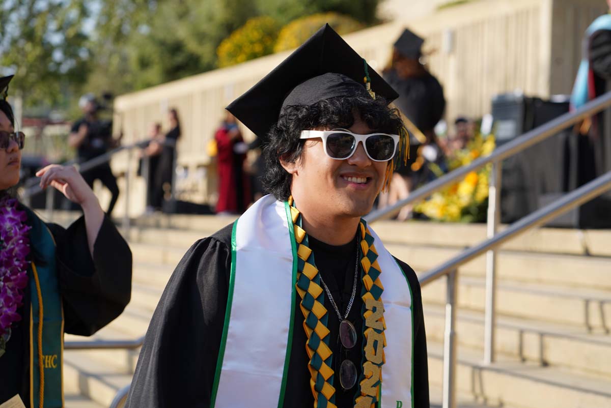 Graduates walk to stage at CHC's Commencement 2024.