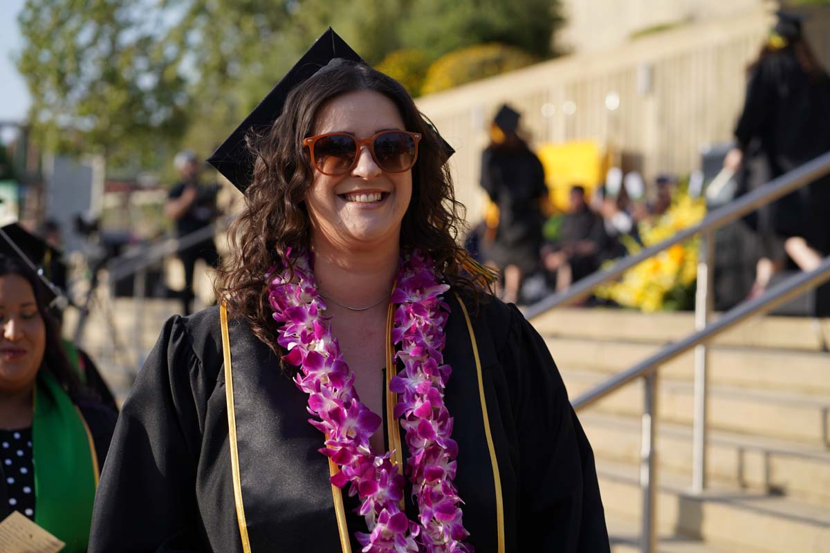 Graduates walk to stage at CHC's Commencement 2024.