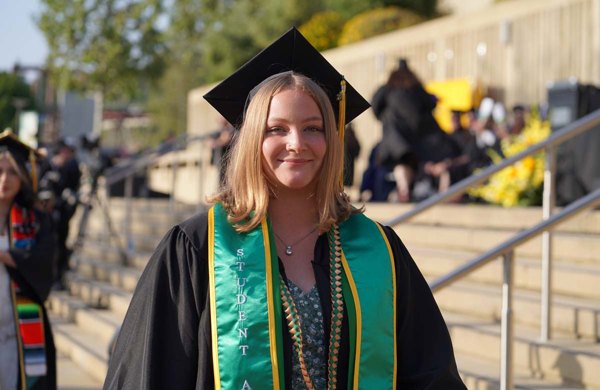 Graduates walk to stage at CHC's Commencement 2024.