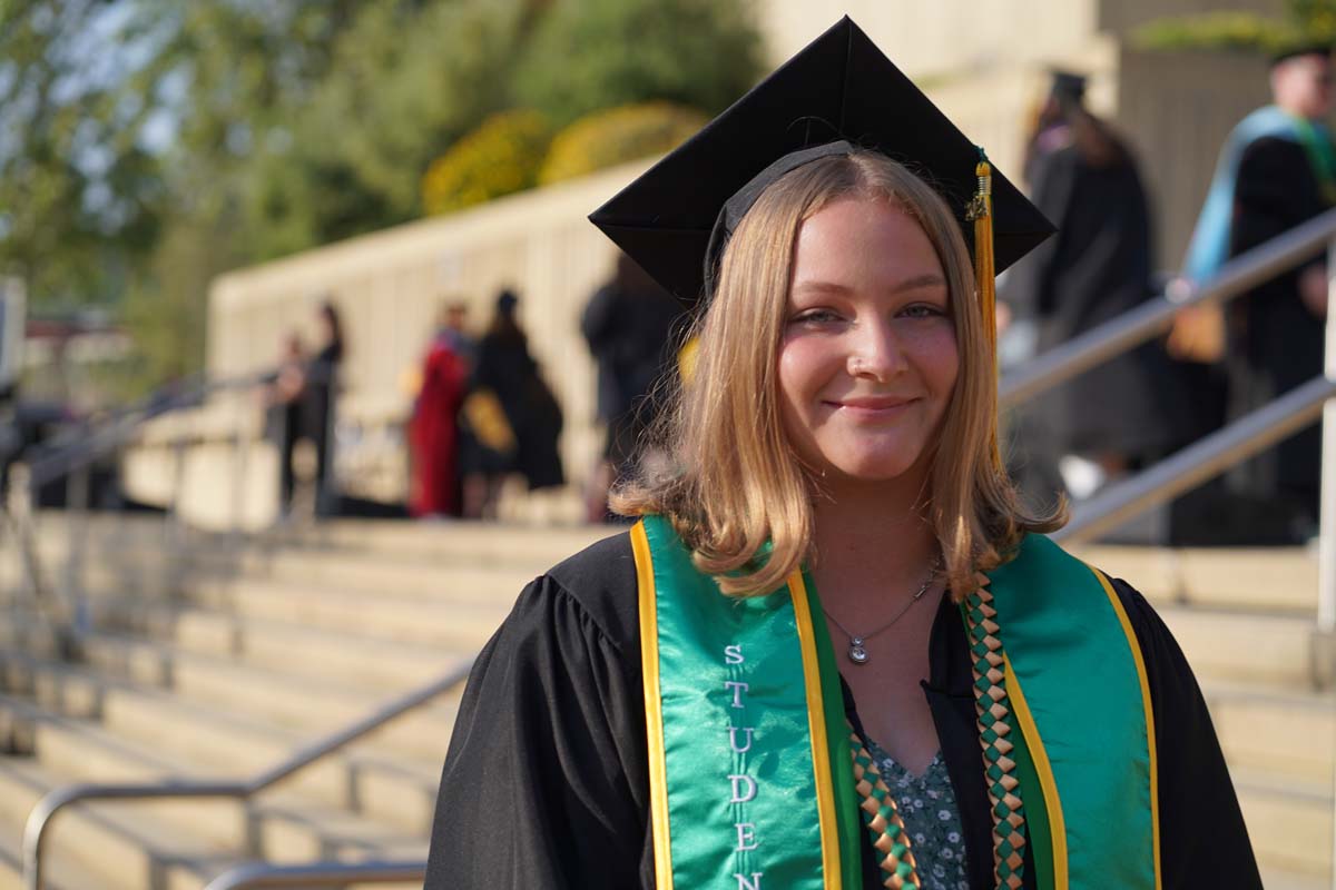Graduates walk to stage at CHC's Commencement 2024.