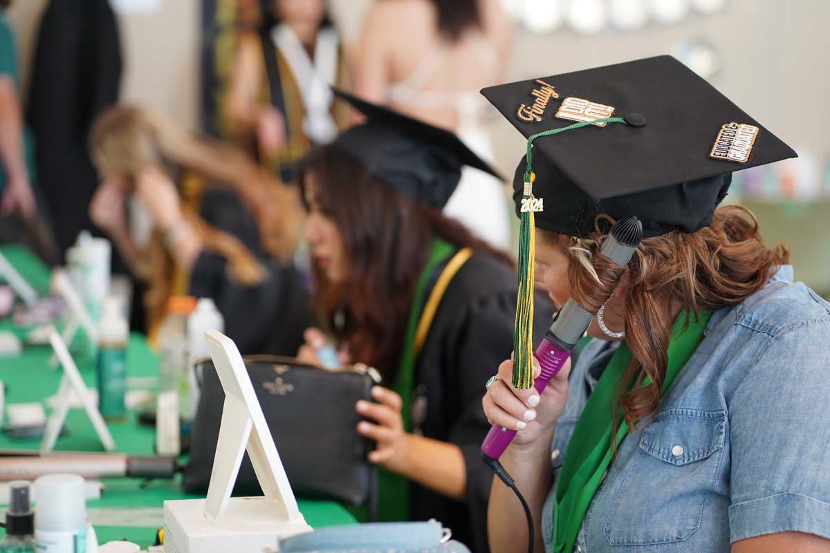 Graduates prepare for CHC Commencement 2024.