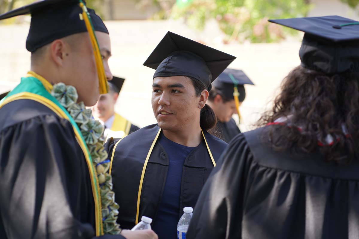 Graduates prepare for CHC Commencement 2024.
