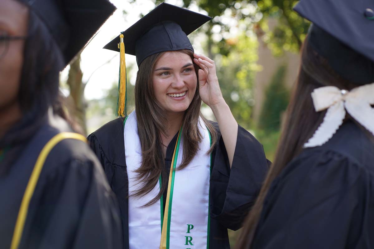 Graduates prepare for CHC Commencement 2024.